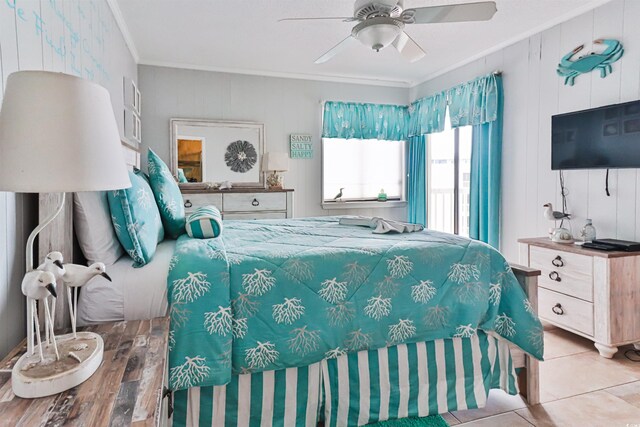 bedroom with crown molding, light tile patterned floors, and ceiling fan