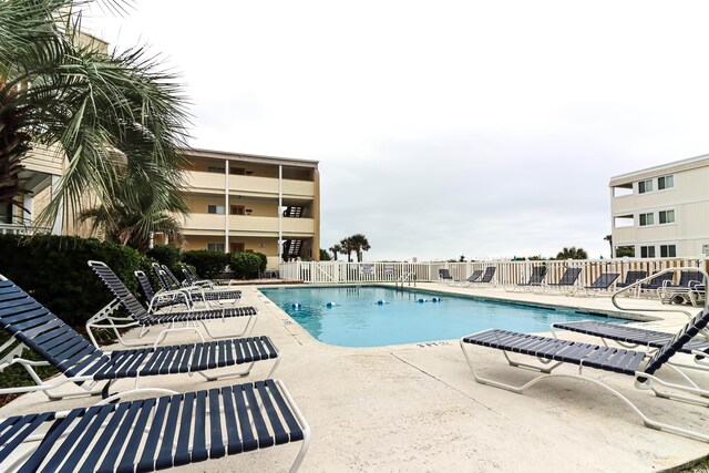 view of swimming pool featuring a patio area