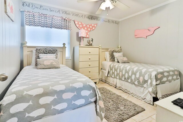 tiled bedroom featuring crown molding and ceiling fan