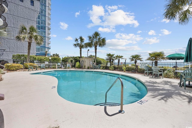 view of swimming pool featuring a patio area