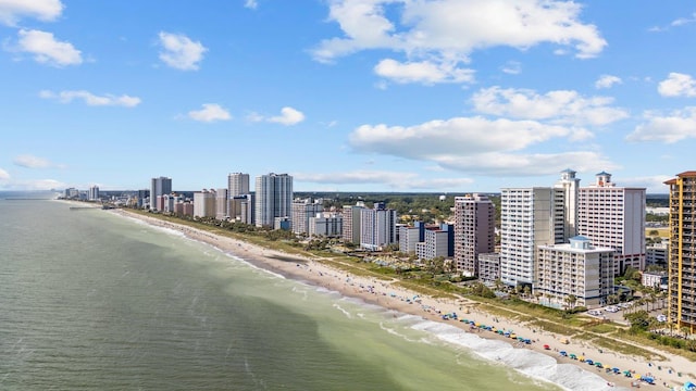 drone / aerial view featuring a view of the beach and a water view