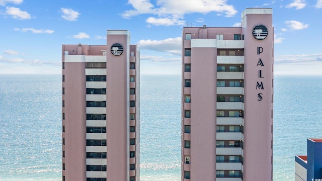 view of building exterior with a water view