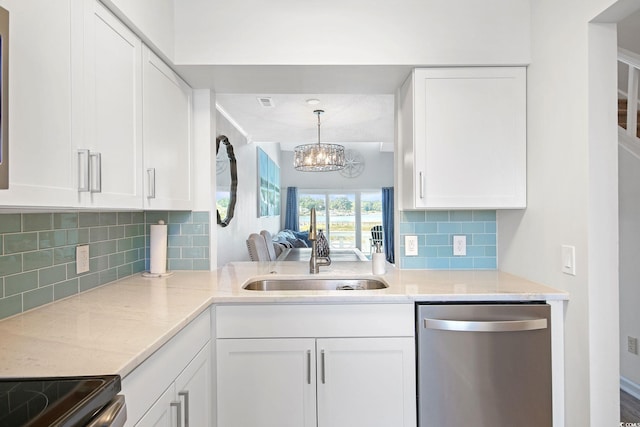 kitchen featuring an inviting chandelier, decorative backsplash, white cabinetry, and dishwasher