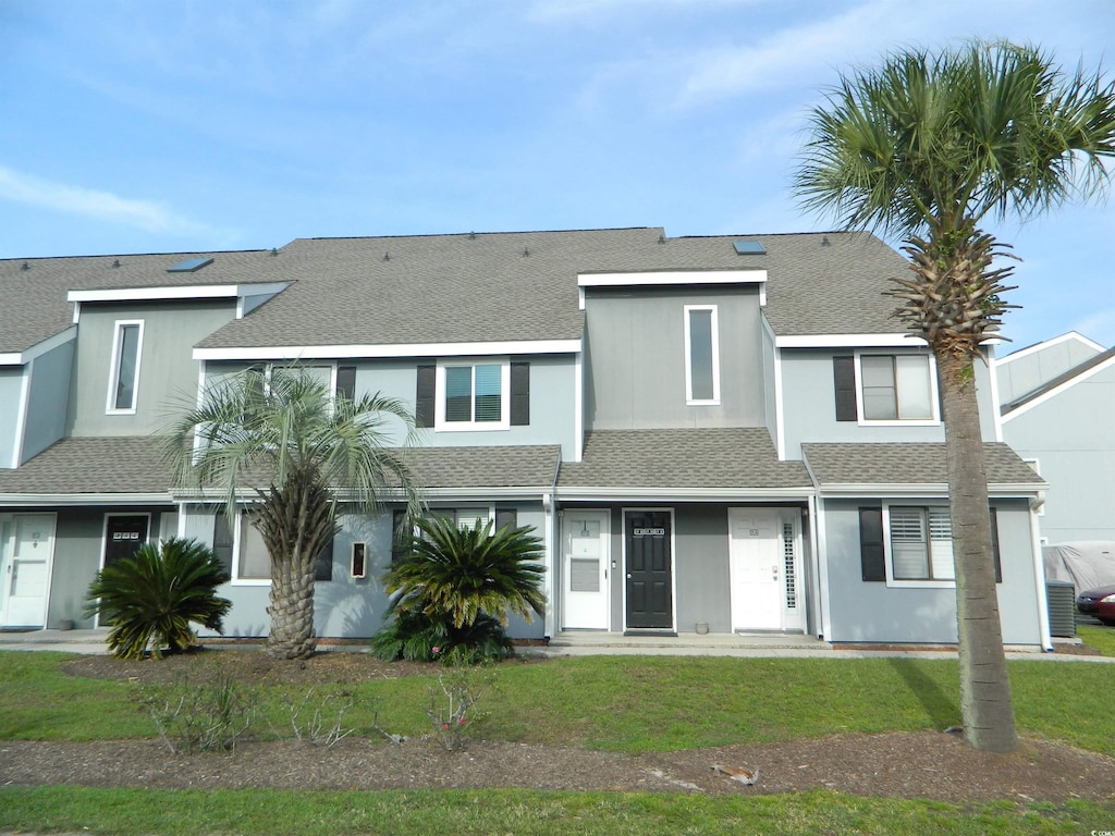 view of property featuring a front yard