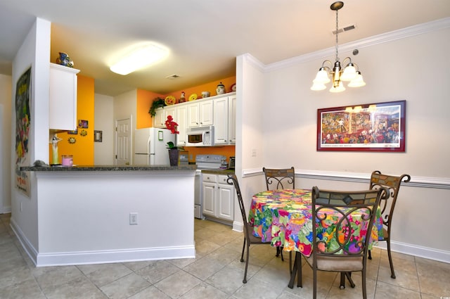 2013 Silvercrest Dr Unit 30-H, Myrtle Beach, SC 29579 - kitchen featuring white appliances, a chandelier, baseboards, white cabinetry, and ornamental molding