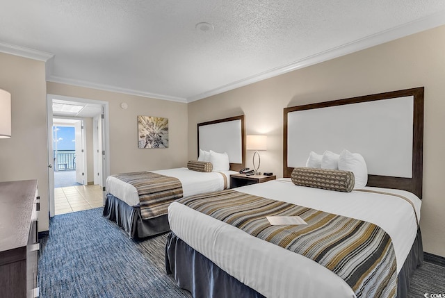 tiled bedroom featuring a textured ceiling and crown molding