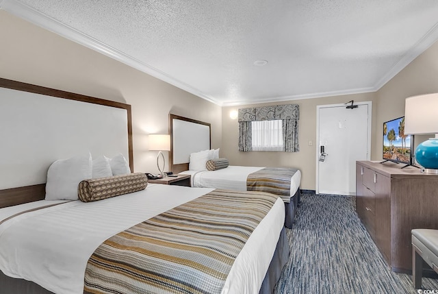 carpeted bedroom featuring a textured ceiling and crown molding