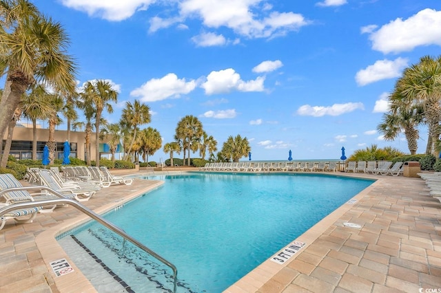 view of swimming pool with a patio