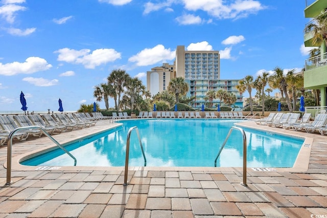 view of swimming pool with a patio