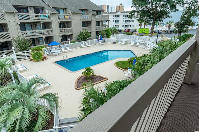 view of swimming pool featuring a patio