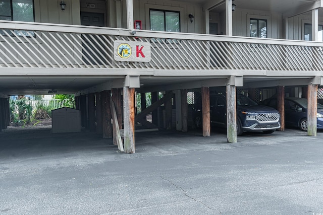 view of parking / parking lot with a carport