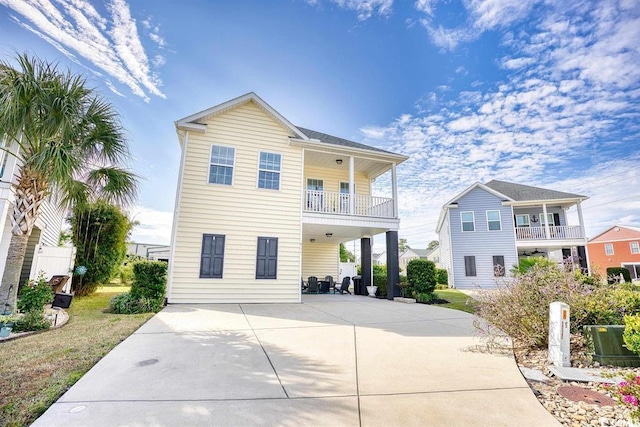 view of front of property with a balcony and a porch