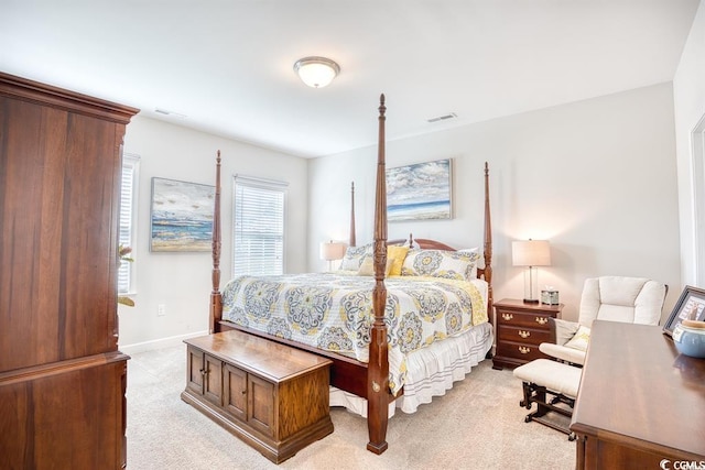 bedroom featuring light colored carpet