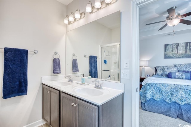 bathroom with ceiling fan, vanity, and an enclosed shower