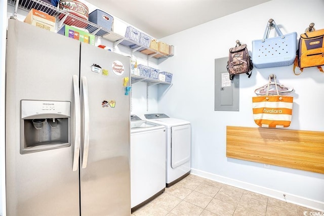 laundry room with separate washer and dryer, electric panel, and light tile patterned floors