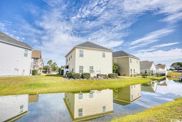 rear view of house with a water view