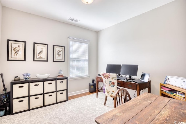 office space with light hardwood / wood-style floors