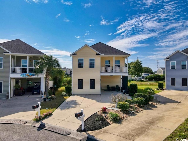 coastal home with a porch and a garage