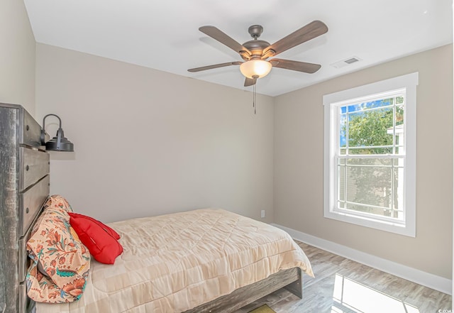 bedroom featuring ceiling fan and light wood-type flooring