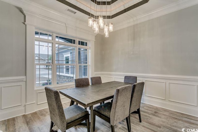 1104 Maccoa Dr, Conway, SC 29526 - dining room featuring an inviting chandelier, light wood-style flooring, visible vents, a decorative wall, and ornamental molding