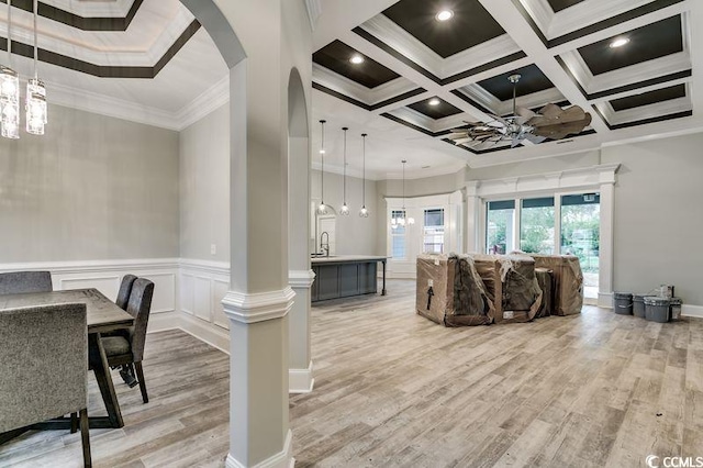 1104 Maccoa Dr, Conway, SC 29526 - living area with beam ceiling, ornamental molding, light wood-style flooring, arched walkways, and coffered ceiling