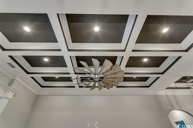 interior details with coffered ceiling, crown molding, and beam ceiling