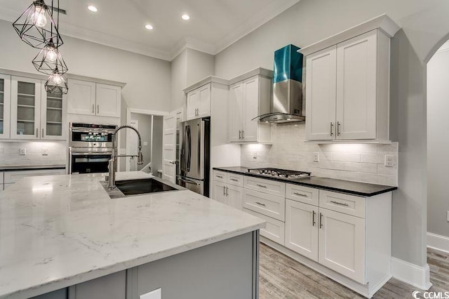 1104 Maccoa Dr, Conway, SC 29526 - kitchen with a sink, arched walkways, wall chimney range hood, appliances with stainless steel finishes, and ornamental molding