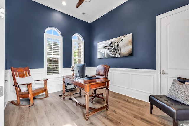 home office featuring ceiling fan, light hardwood / wood-style floors, and ornamental molding