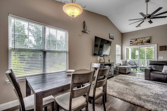 dining area with wood-type flooring, lofted ceiling, and ceiling fan