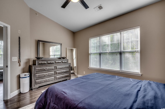 bedroom with wood-type flooring, vaulted ceiling, and ceiling fan