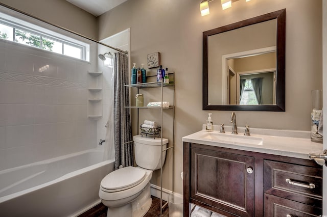 full bathroom with vanity, plenty of natural light, shower / tub combo, and toilet