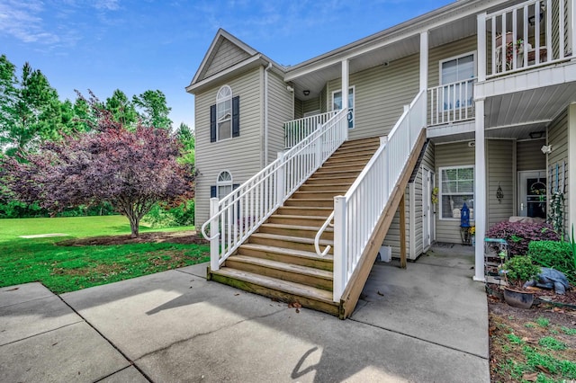 exterior space featuring a patio and a front yard