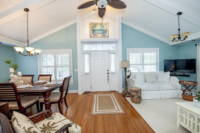 interior space with beam ceiling, plenty of natural light, and light wood-type flooring