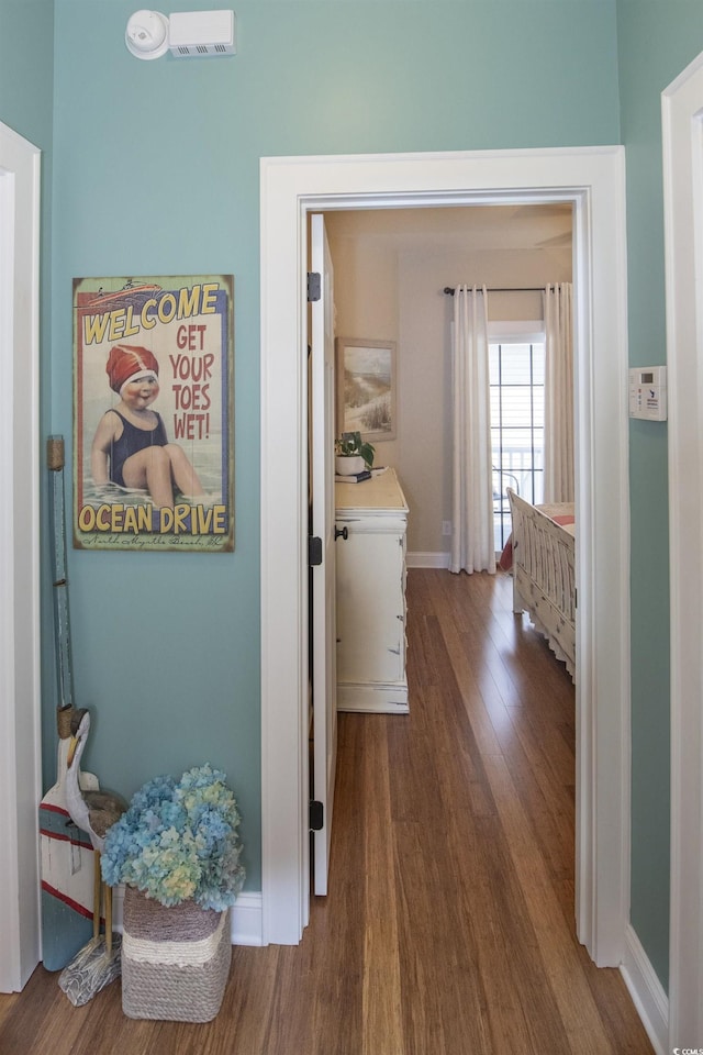 corridor featuring hardwood / wood-style floors