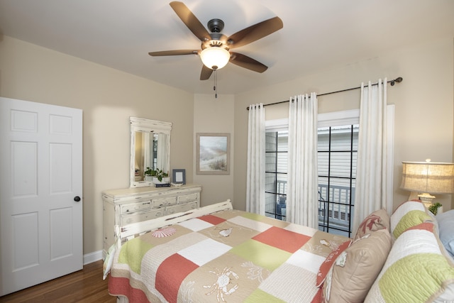 bedroom featuring dark wood-type flooring and ceiling fan