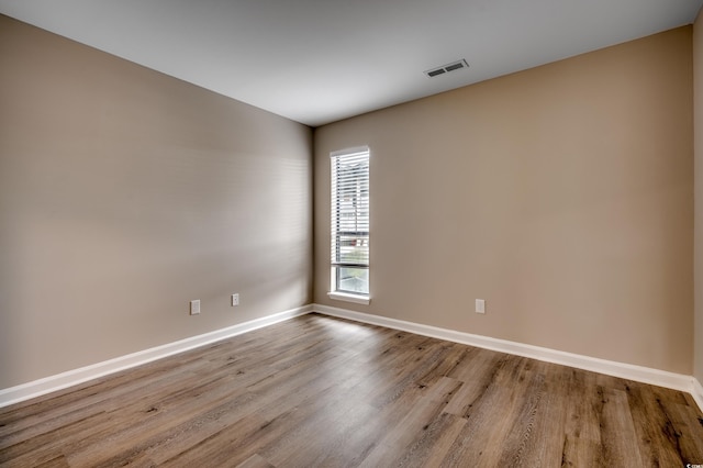 spare room featuring light wood-type flooring