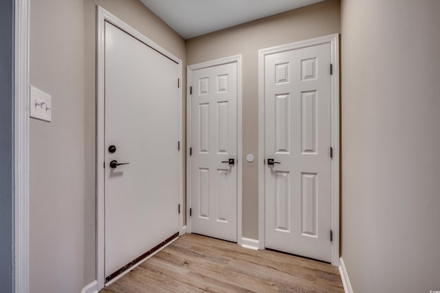 doorway to outside with light hardwood / wood-style flooring