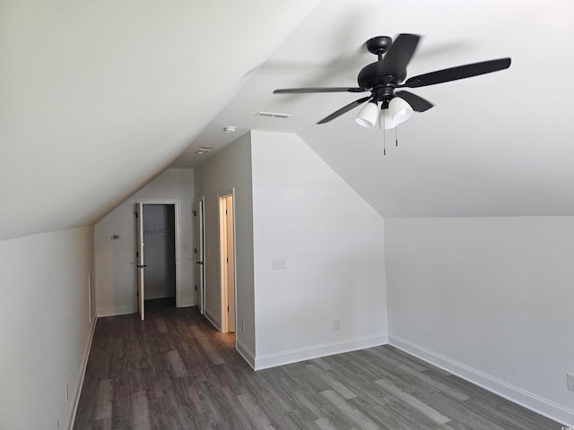 bonus room featuring vaulted ceiling, ceiling fan, and dark hardwood / wood-style floors