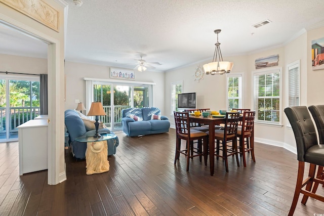 1100 Commons Blvd Unit 104, Myrtle Beach, SC 29572 - dining room with dark wood-type flooring, plenty of natural light, ceiling fan, ornamental molding, and a textured ceiling