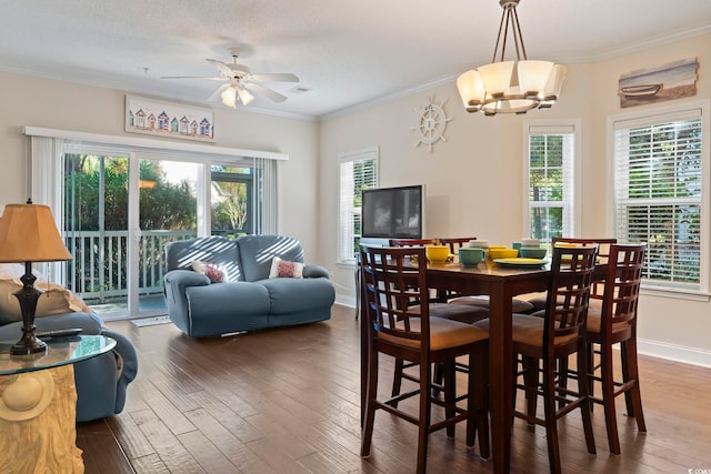 1100 Commons Blvd Unit 104, Myrtle Beach, SC 29572 - dining area featuring ornamental molding, hardwood / wood-style floors, plenty of natural light, ceiling fan, and a chandelier