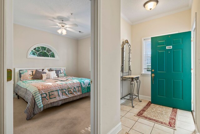1100 Commons Blvd Unit 104, Myrtle Beach, SC 29572 - tiled entryway featuring crown molding, a ceiling fan, and a textured ceiling