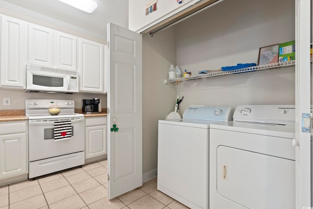 1100 Commons Blvd Unit 104, Myrtle Beach, SC 29572 - laundry area featuring light tile patterned floors and washer and clothes dryer