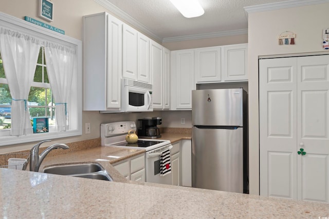 kitchen with a wealth of natural light, white cabinets, a kitchen bar, and dark hardwood / wood-style flooring