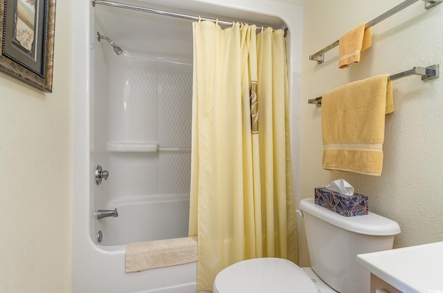 full bathroom featuring shower / bath combination with curtain, vanity, and toilet