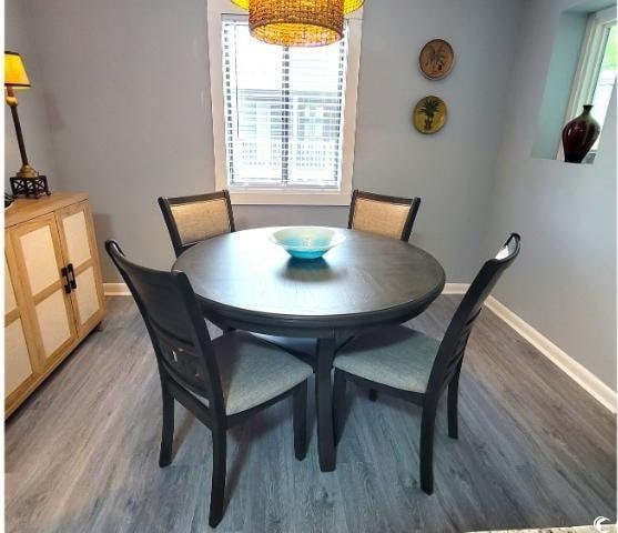 10166 Beach Dr Unit 5306, Calabash, NC 28467 - dining area featuring baseboards and light wood-style flooring