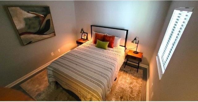 10166 Beach Dr Unit 5306, Calabash, NC 28467 - carpeted bedroom featuring baseboards