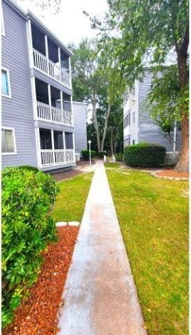 10166 Beach Dr Unit 5306, Calabash, NC 28467 - view of property's community with a lawn