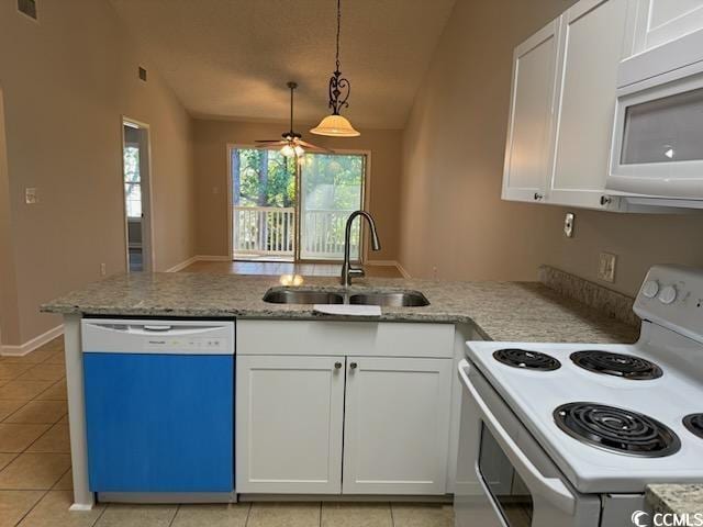 3681 Claypond Rd Unit 3107, Myrtle Beach, SC 29579 - kitchen with electric range, dishwasher, a sink, stainless steel microwave, and lofted ceiling