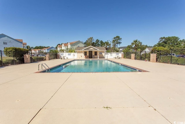 view of swimming pool featuring a patio area