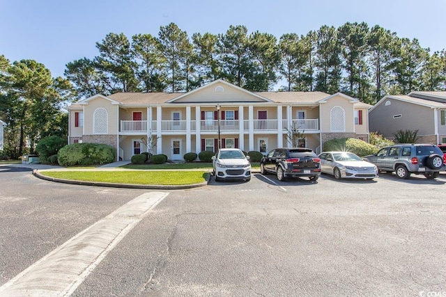 view of front of property with a balcony